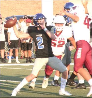 BOTTOM: Quarterback Andrew Shumard tries to pass the ball against Tuttle during Newcastle’s 41-7 defeat to the Tigers.