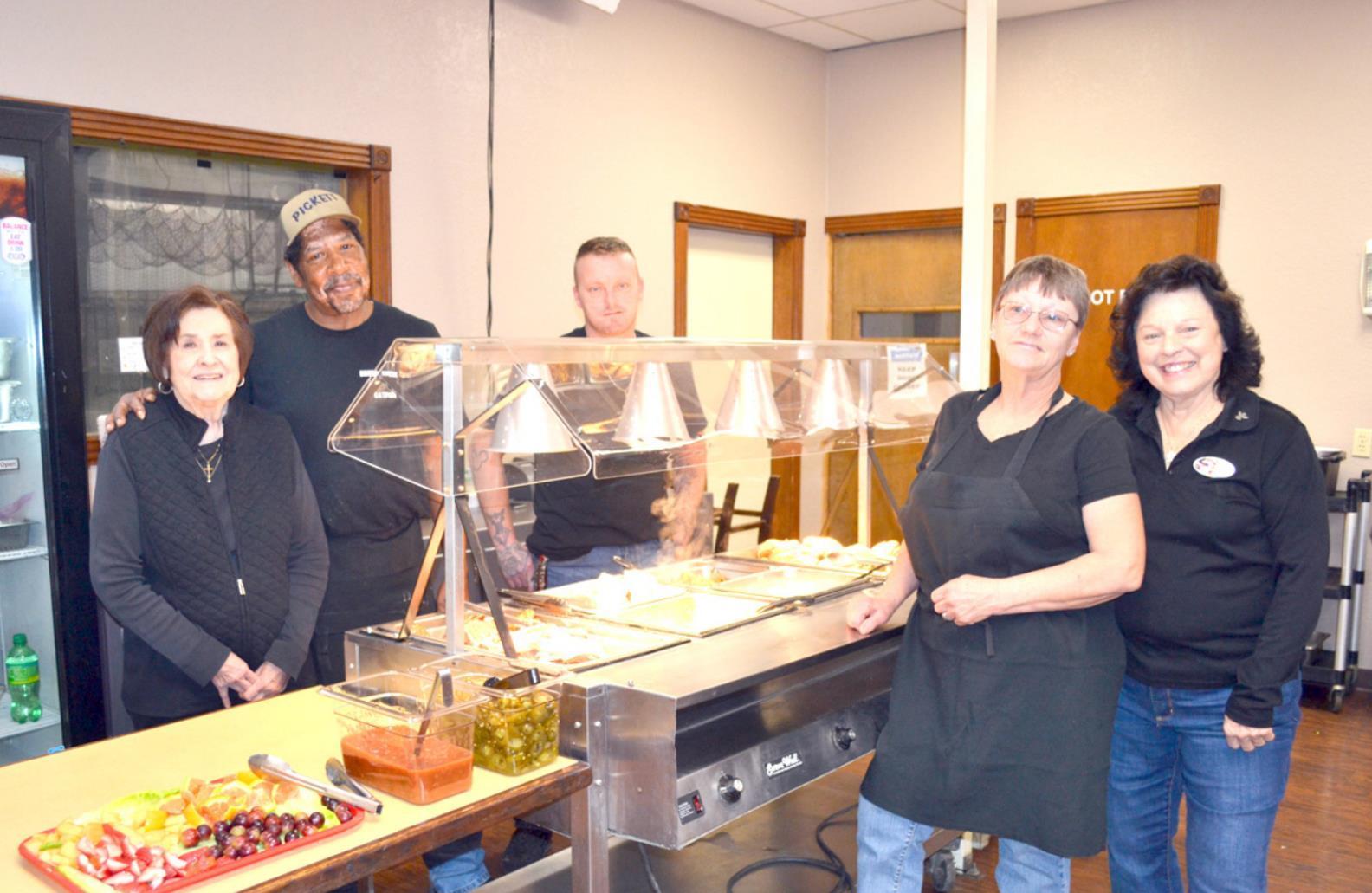Representatives of Brush Creek BBQ &amp;amp; Catfish gathered around the new Breakfast Bar Friday morning. Pictured, from left, are: owner Reta Gilliam, chef Andra Pickett, Gary Skinner, Michelle Redding and JoAnn Ray. • photo by Mark Codner